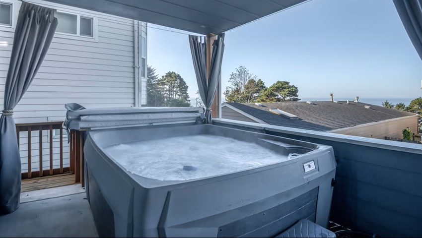Moby House Moby House private deck hot tub with partial ocean views in Depoe Bay.